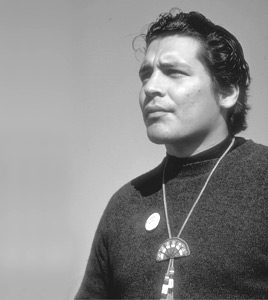 Ricard Oakes, indigenous activist, standing roack