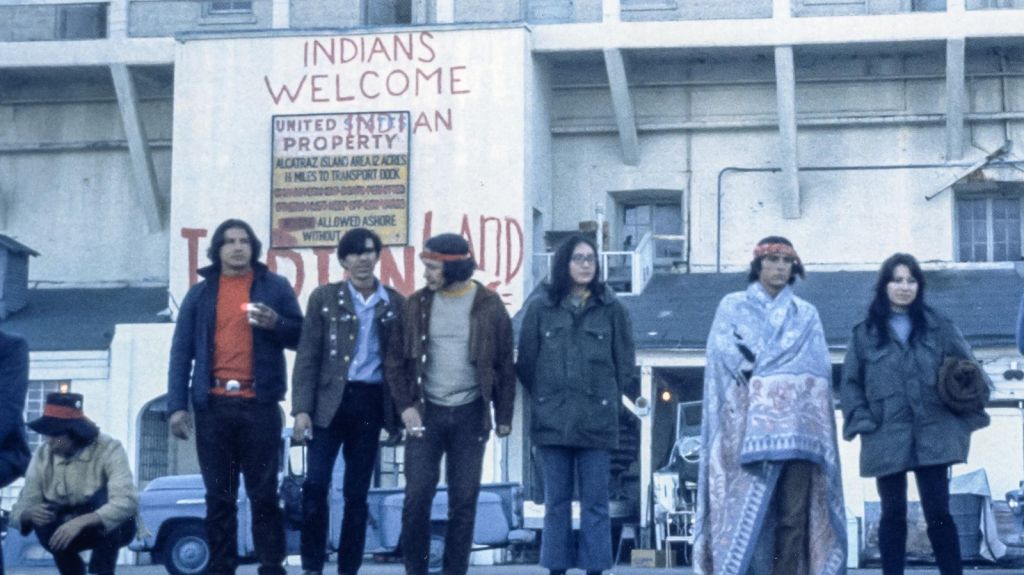 Occupiers standing on the dock at Alcatraz, 1969