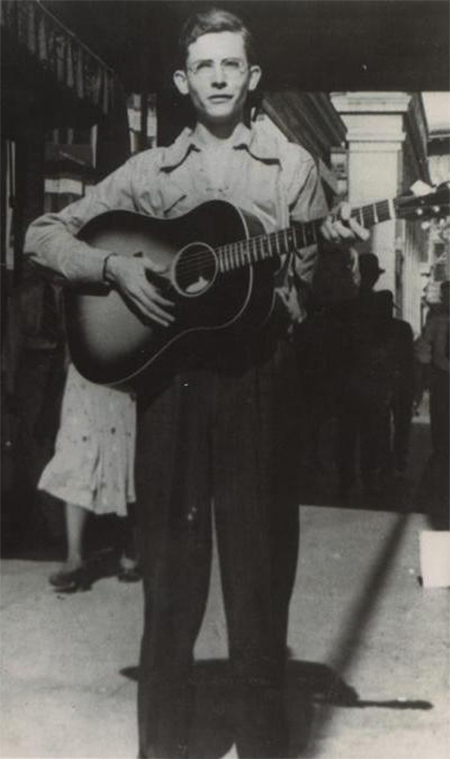 Hank Williams playing guitar in Montgomery, Alabama in 1938.