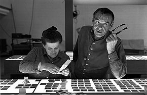 Ray and Charles Eames selecting slides for the exhibition, “Photography & the City, 1968.” © 2011 Eames Office, LLC.