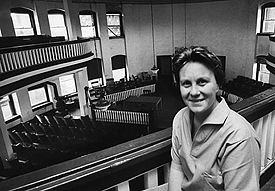 Harper Lee poses for Life magazine in the balcony of the old courthouse in Monroeville, Alabama, May 1961.