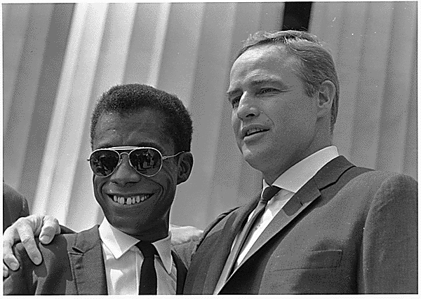 James Baldwin and Marlon Brando at Civil Rights March in Washington, D.C., 08/28/1963.U.S. Information Agency. Press and Publications Service. 