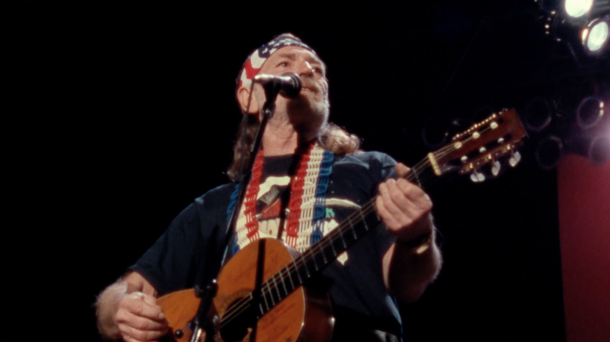 Willie Nelson performing at Nassau Coliseum in Uniondale, N.Y., in 1990 with The Highwaymen. Screenshot from The Highwaymen: Friends Till The End. Courtesy of Sony Music Entertainment. 