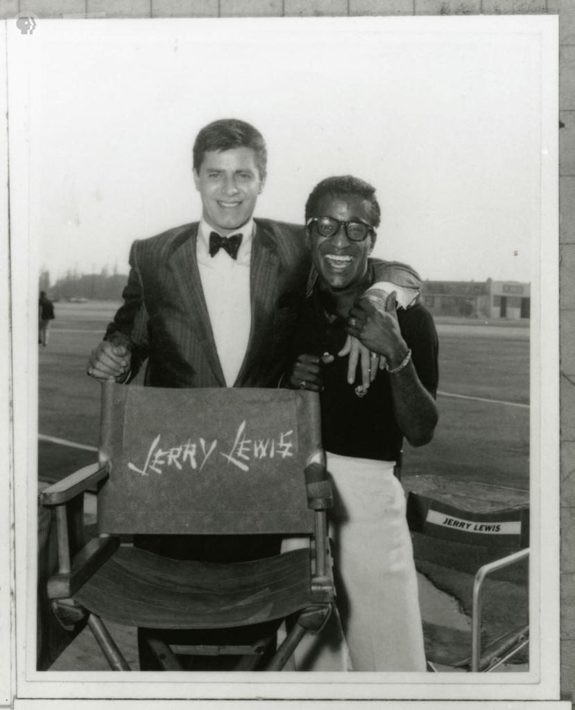 Jerry Lewis with his own director’s chair and arm around Sammy Davis, Jr. Credit: Sammy Davis, Jr. Estate
