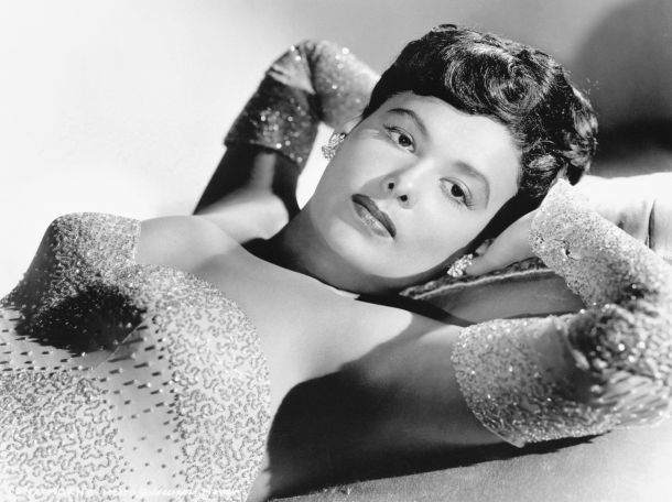 Lena Horne poses in a sequined gown.