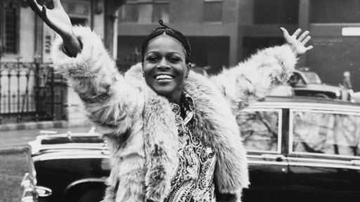 Portrait of Academy Award winning American actress Cicely Tyson smiling and raising her arms in the air during a visit to London, February 19th 1973.