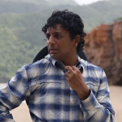 M. Night Shyamalan on a film shoot.