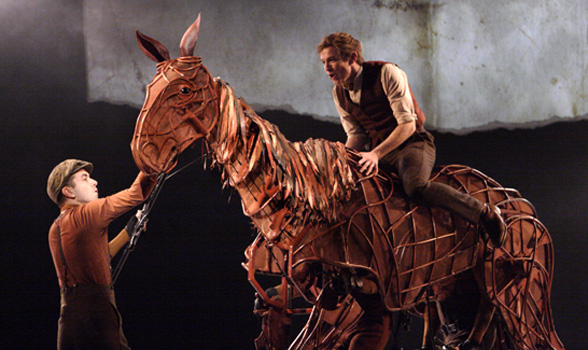 JACK HOLDEN as Albert in War Horse, with TOBY OLIÈ, THOMAS WILTON and MICHAEL BRETT as Joey, in 50 Years on Stage. Photo by Catherine Ashmore.