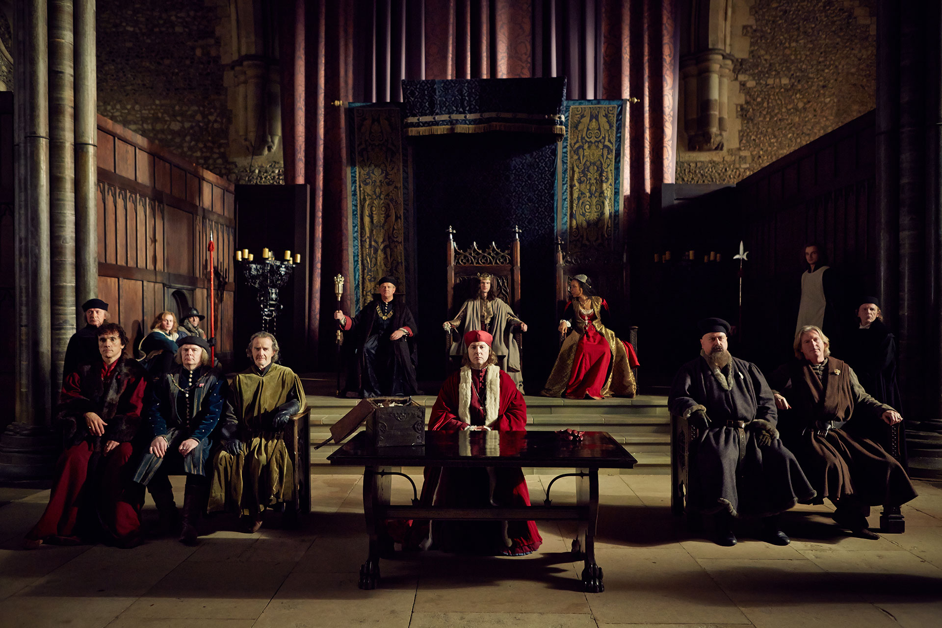 (From l to r) Ben Miles (as SOMERSET), Jason Watkins (as SUFFOLK), Anton Lesser (as EXETER), Hugh Bonneville (as GLOUCESTER), Tom Sturridge (as HENRY VI), Samuel West (as BISHOP OF WINCHESTER), Sophie Okonedo (as MARGARET), Stanley Townsend (as WARWICK) and Adrian Dunbar (as PLANTAGENET) in “The Hollow Crown: The Wars of the Roses Henry VI (Part I).” Credit: Robert Viglasky © 2015 Carnival Film & Television Ltd