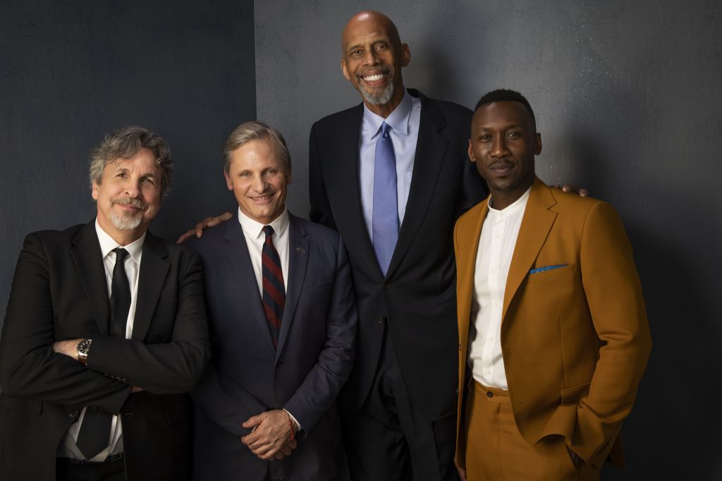 Winners Accepting the Best Picture Award for <i>Green Book</i> (from left to right) Peter Farrelly, Viggo Mortensen, Mahershala Ali with presenter Kareem Abdul-Jabbar (second from right). Photo by Kwaku Alston.