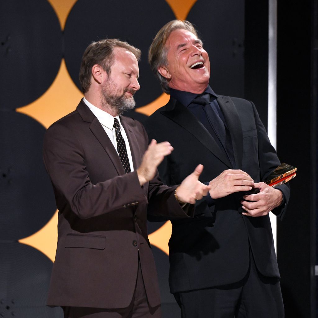 BEVERLY HILLS, CALIFORNIA - JANUARY 11: Don Johnson (R) accepts Best Ensemble for 'Knives Out' from Rian Johnson onstage during AARP The Magazine's 19th Annual Movies For Grownups Awards at Beverly Wilshire, A Four Seasons Hotel on January 11, 2020 in Beverly Hills, California. (Photo by Michael Kovac/Getty Images for AARP)