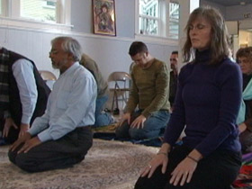 Rahman leading a group in Salat