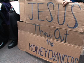 A protester holds a sign at the Occupy Wall Street protests in New York City: "Jesus Threw Out the Moneychangers"