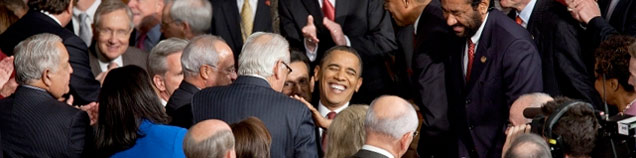 President Obama greets members of Congress before delivering his State of the Union Address