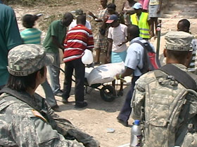 US military personnel overseeing food aid distribution