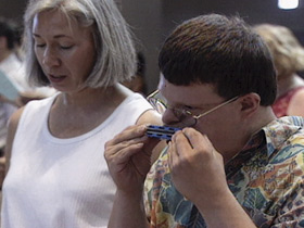 disabled man harmonica 