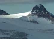 The South Pole lies at the end of a high plateau, beyond the Transantarctic Mountains