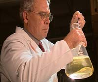 Professor Stephen J. Mattingly at work in his laboratory, demonstrating that bacteria could have influenced the accuracy of the carbon-14 dating of the Shroud