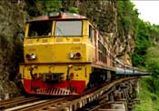 A train runs on one of the few surviving sections of the original Thailand-Burma Railway.